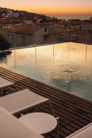 Seasonal outdoor pool, pool umbrellas, pool loungers