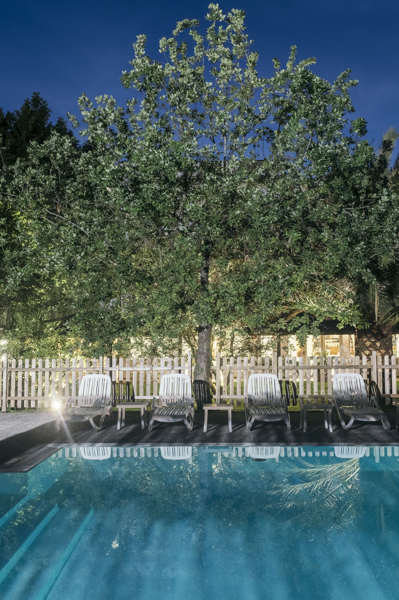 outdoor pool, open 9:30 am to 7:30 pm, pool umbrellas, pool loungers