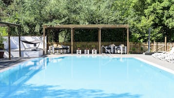 Outdoor pool, open 9:30 AM to 7:30 PM, pool umbrellas, pool loungers