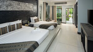 A modern hotel room with two beds, a large black and white artwork on the wall, and a balcony with a view of greenery. - The Zign Hotel (Pattaya)