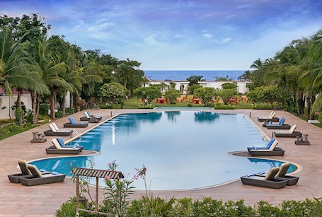 Outdoor pool, open 7:00 AM to 7:00 PM, free cabanas, pool umbrellas