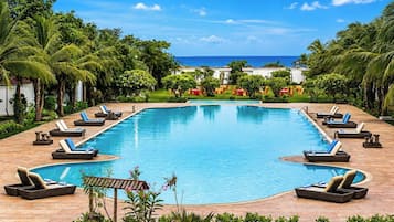 Outdoor pool, open 7:00 AM to 7:00 PM, free cabanas, pool umbrellas