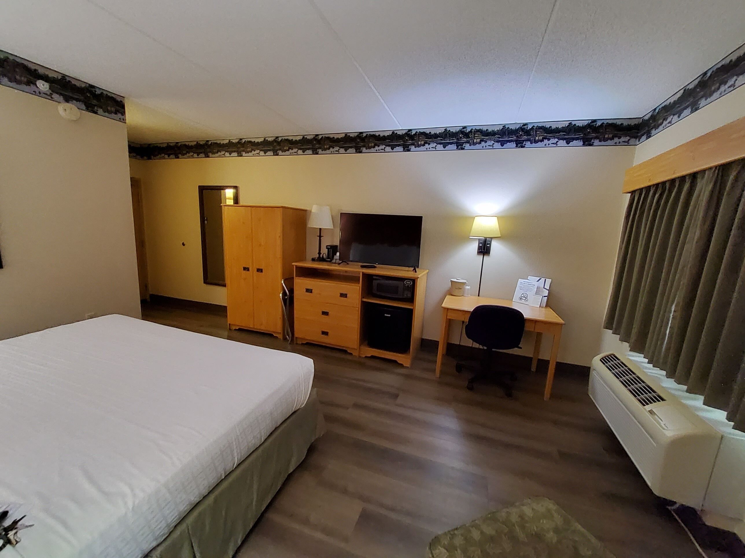 room, 1 king bed, non smoking | in-room safe, desk, iron/ironing board, free cots/infant beds