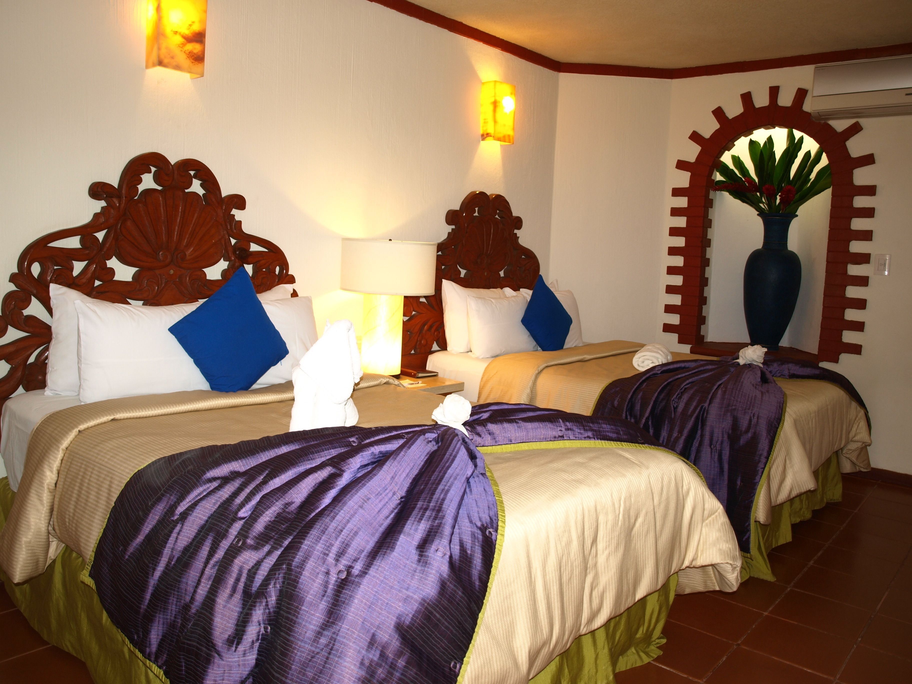 Down comforters, pillowtop beds, in-room safe, desk