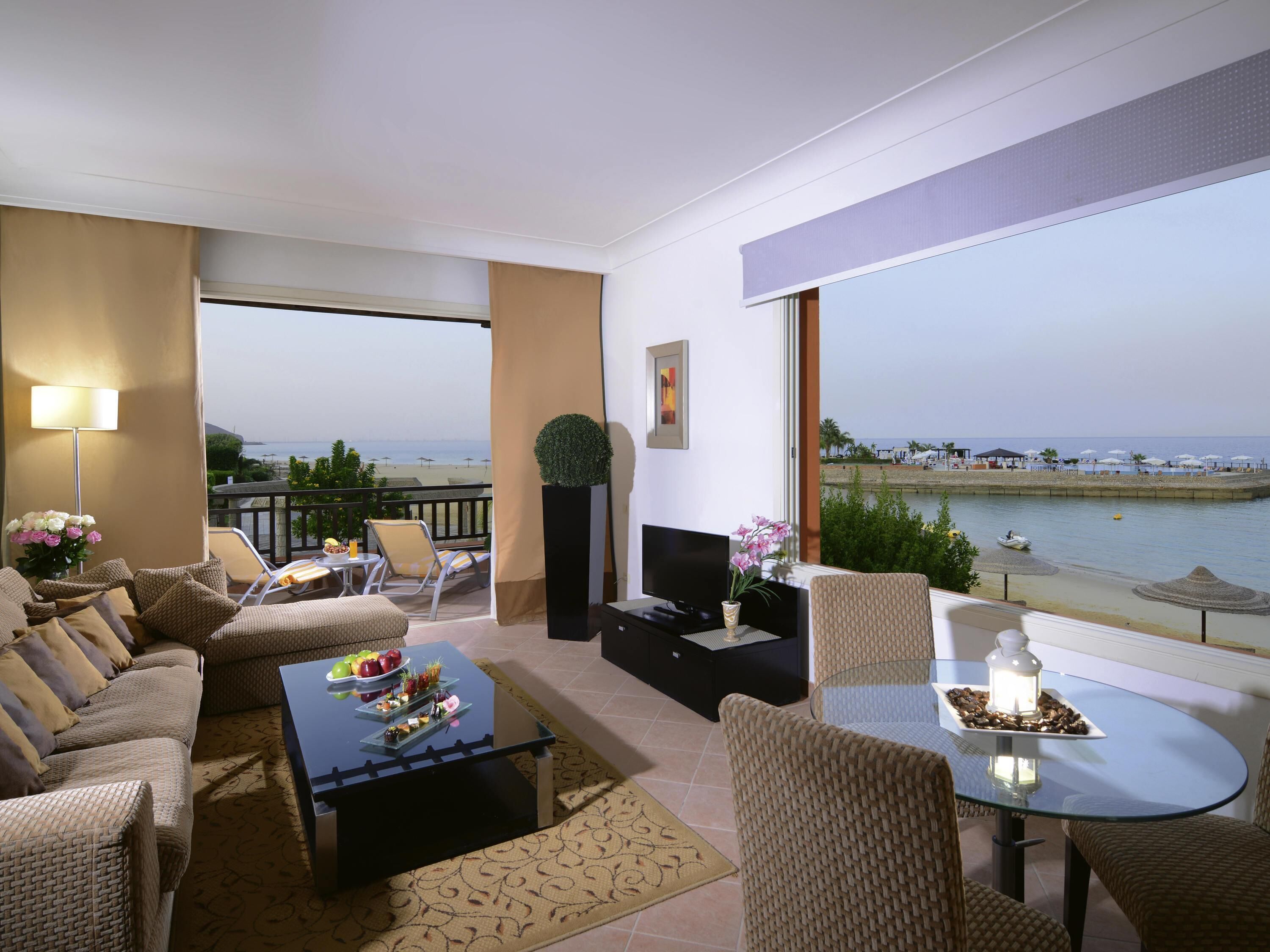 Deluxe Suite, 1 King Bed, Beachfront | Minibar, in-room safe, desk, blackout drapes