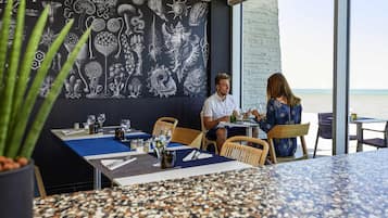 Lunch, dinner served; French cuisine, beach views