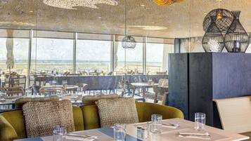 Lunch, dinner served; French cuisine, beach views