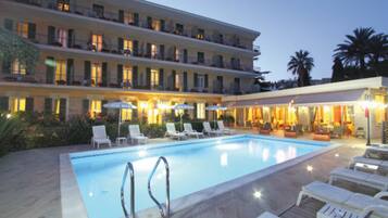 Seasonal outdoor pool, open 9:00 AM to 7:00 PM, pool umbrellas