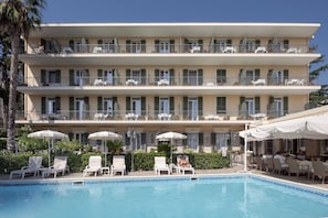 Seasonal outdoor pool, open 9:00 AM to 7:00 PM, pool umbrellas