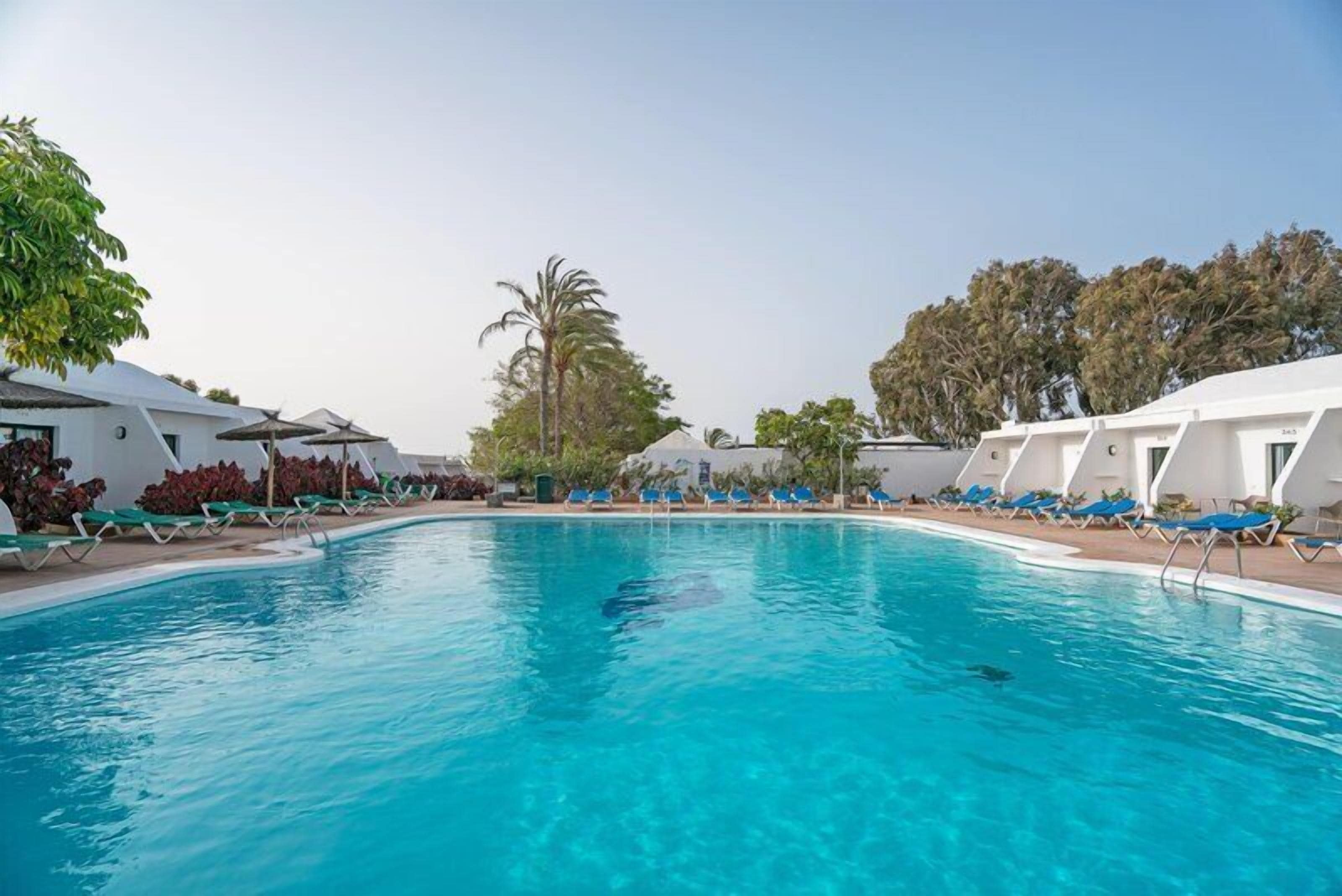 2 outdoor pools, pool umbrellas, pool loungers