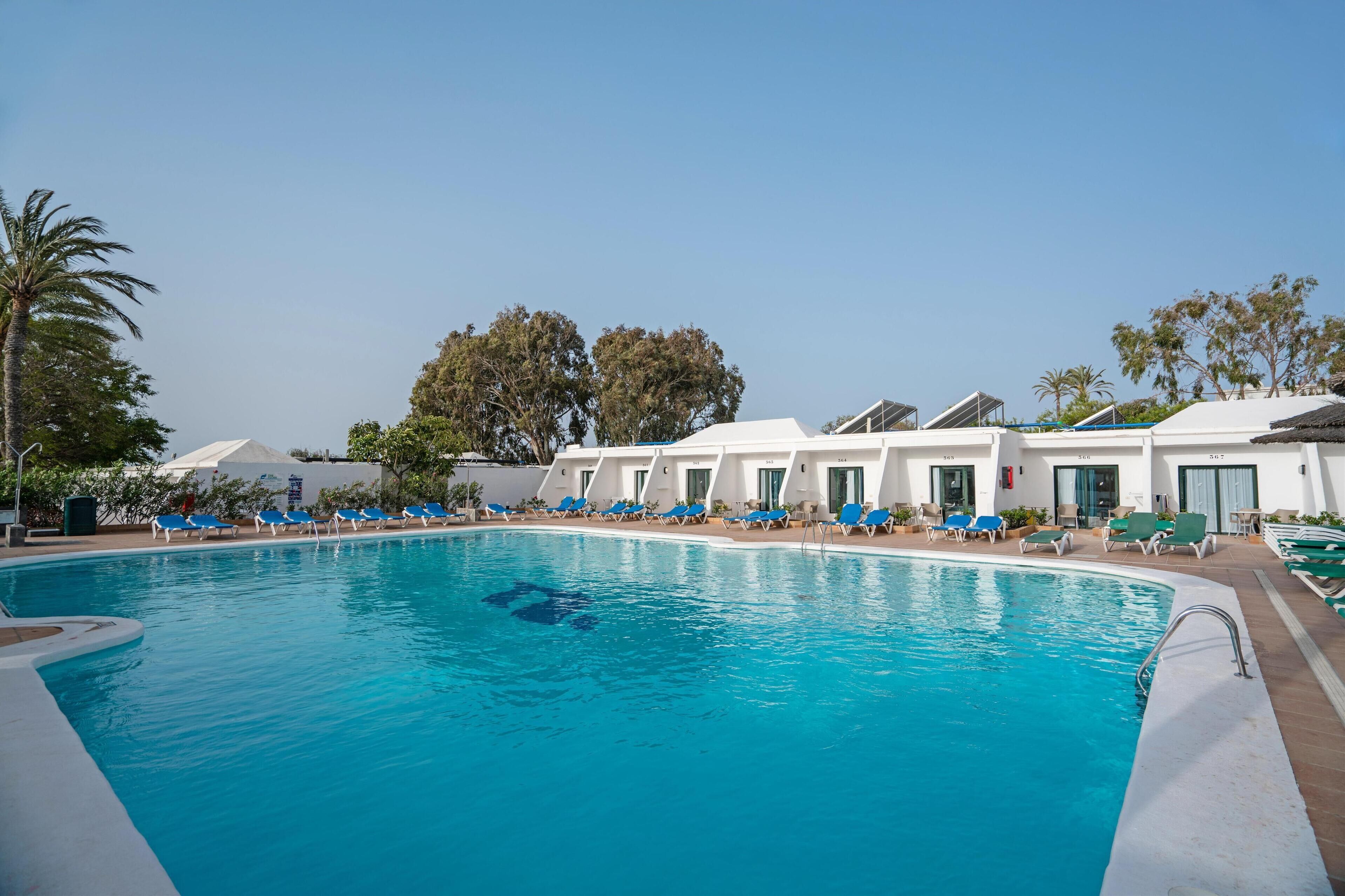 2 outdoor pools, pool umbrellas, pool loungers