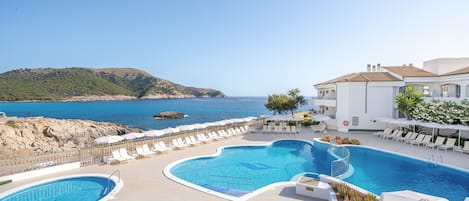 Indoor pool, outdoor pool, pool umbrellas, sun loungers