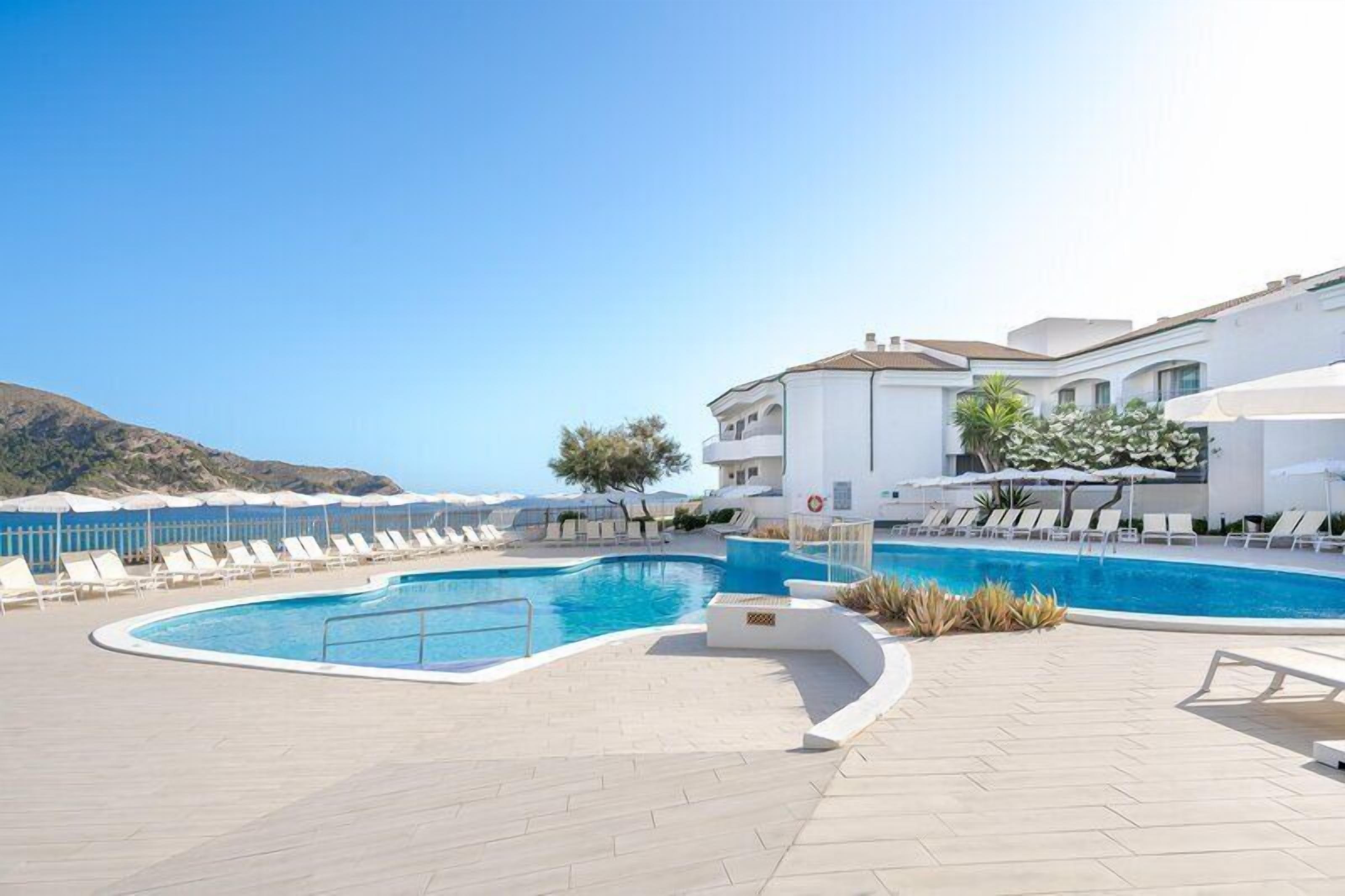 Indoor pool, outdoor pool, pool umbrellas, sun loungers