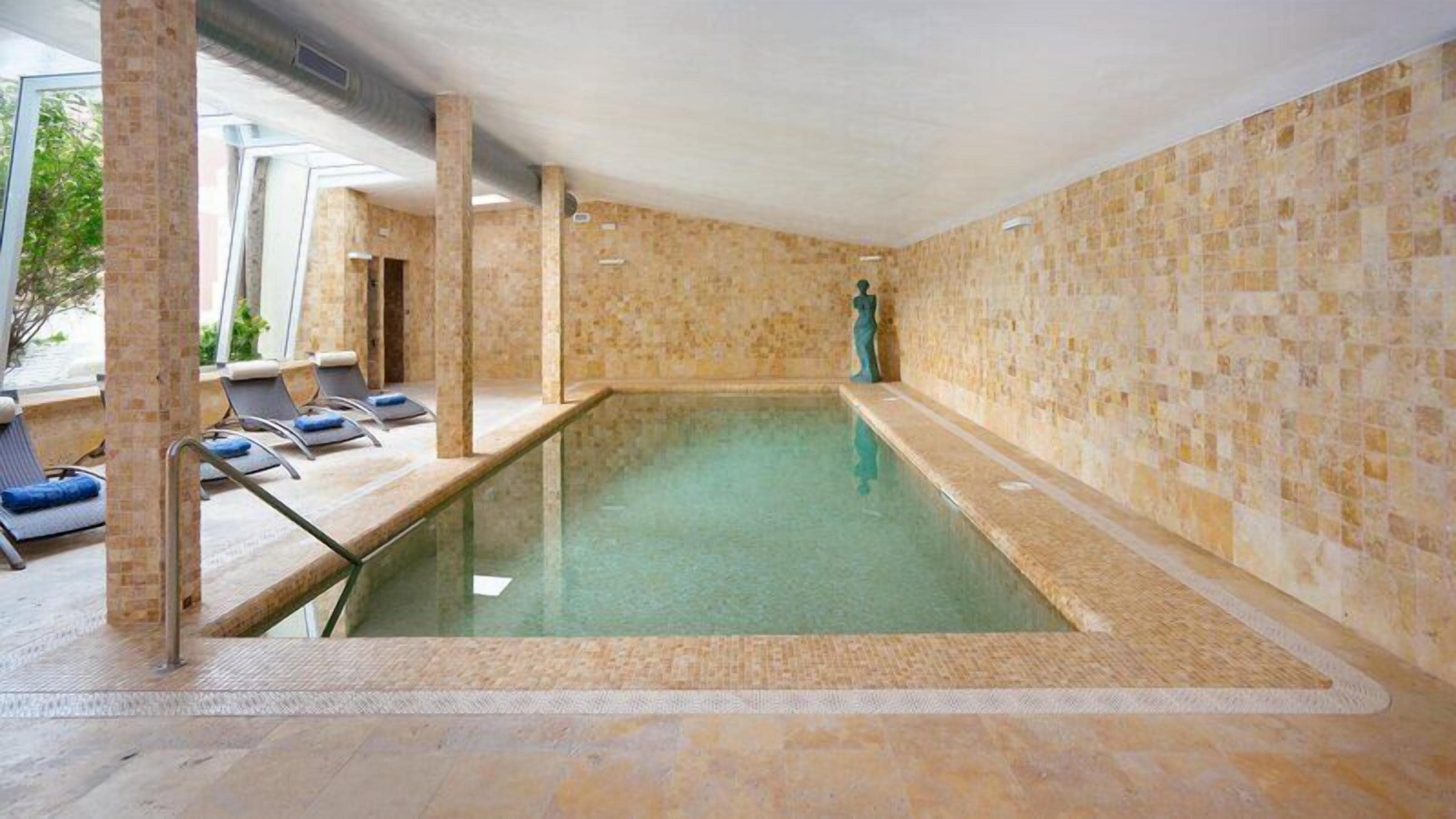 Indoor pool, outdoor pool, pool umbrellas, sun loungers