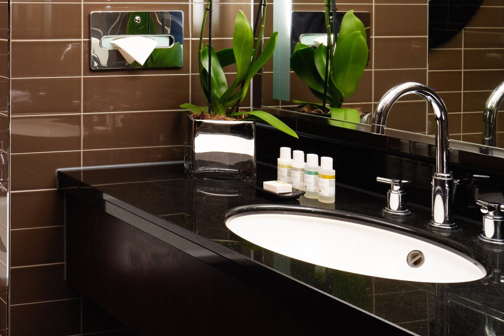 designer toiletries, hair dryer, bathrobes, slippers