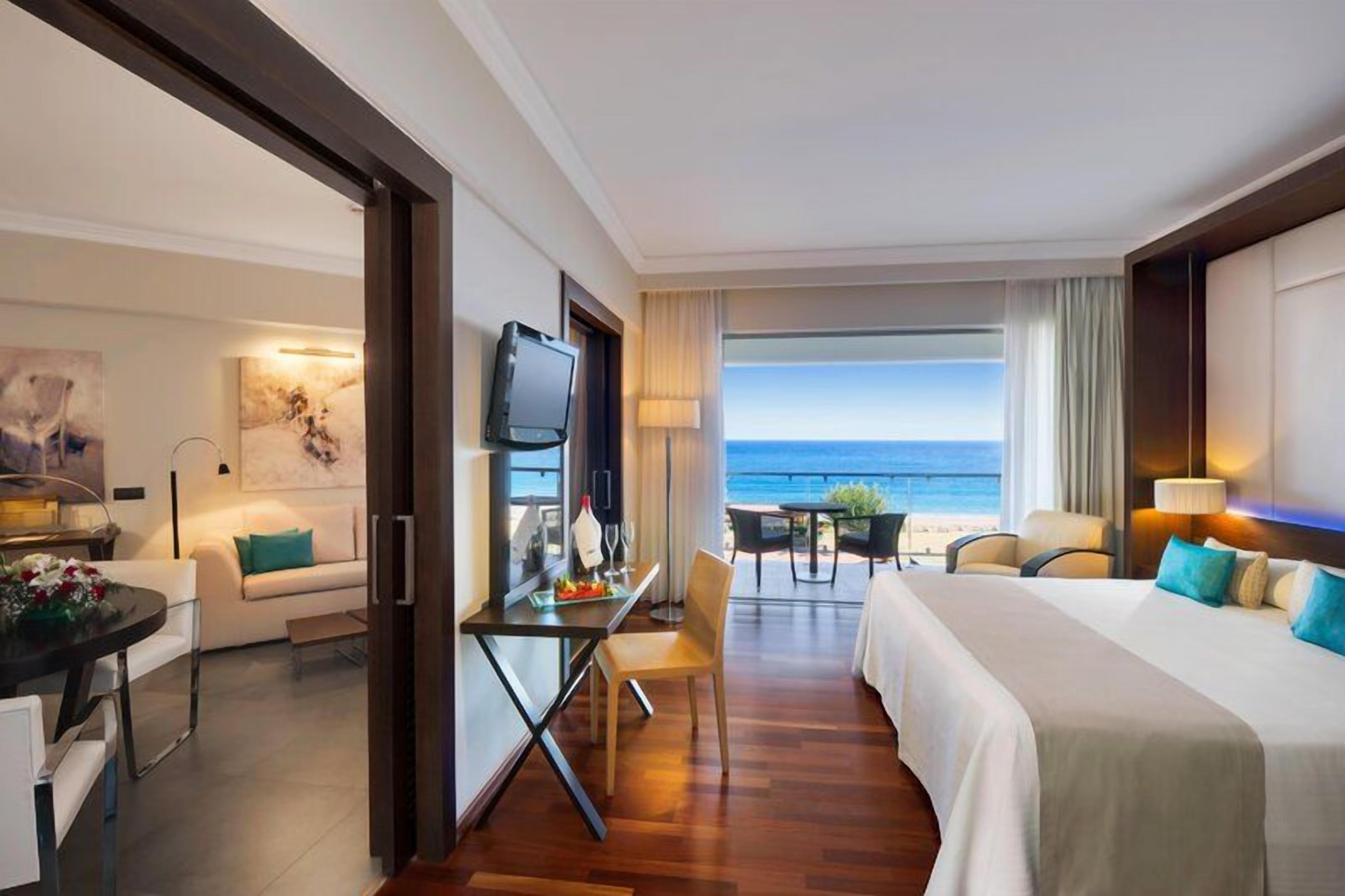 Junior Suite, Sea View (Elite Club) | Hypo-allergenic bedding available, in-room safe, desk, blackout drapes
