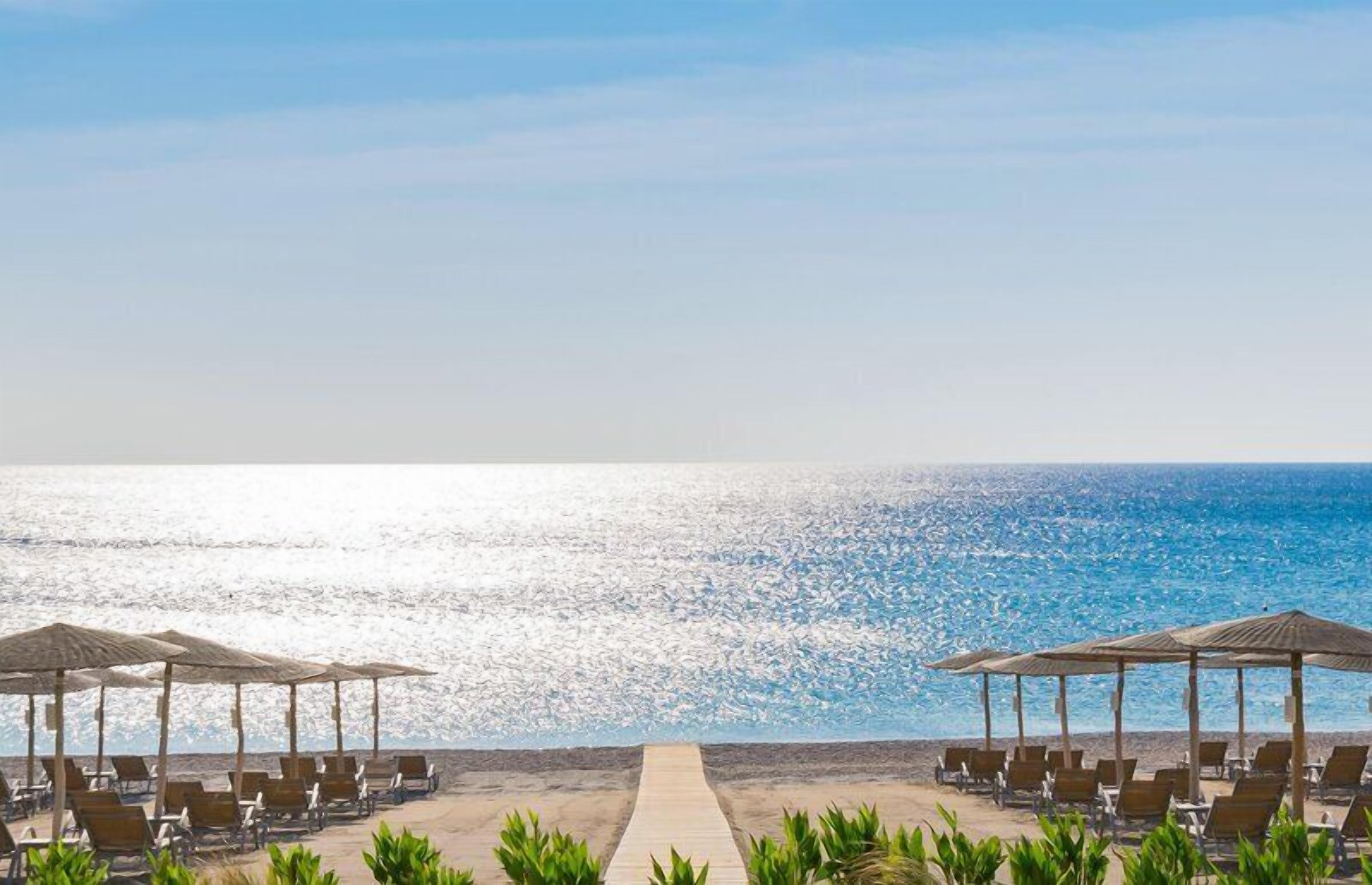 On the beach, beach cabanas, sun loungers, beach umbrellas
