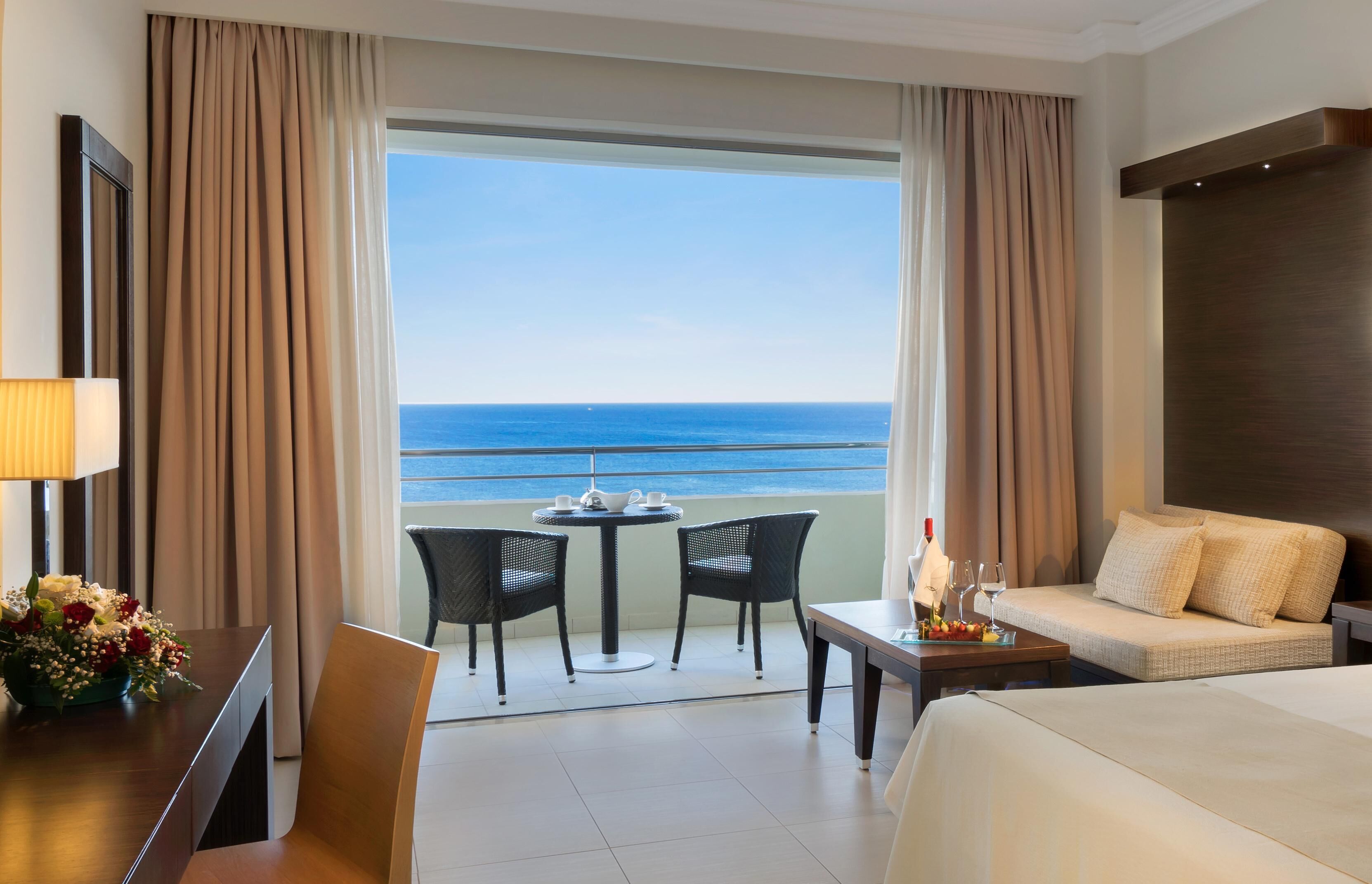 Deluxe Room, Sea View | Hypo-allergenic bedding, in-room safe, desk, blackout drapes