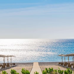 On the beach, beach cabanas, sun loungers, beach umbrellas