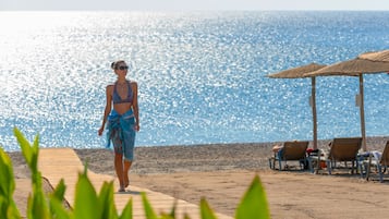 On the beach, beach cabanas, sun loungers, beach umbrellas
