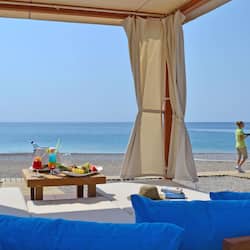 On the beach, beach cabanas, sun loungers, beach umbrellas