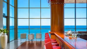 3 bars/lounges, poolside bar, beach bar