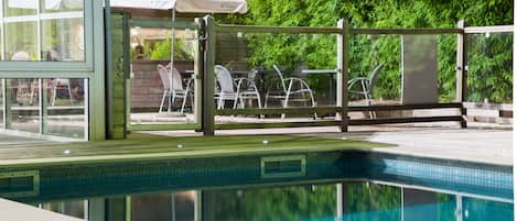 Seasonal outdoor pool, pool loungers