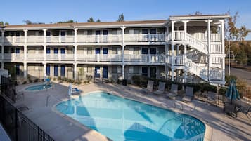 Seasonal outdoor pool, open 10 AM to 9 PM, pool umbrellas, sun loungers