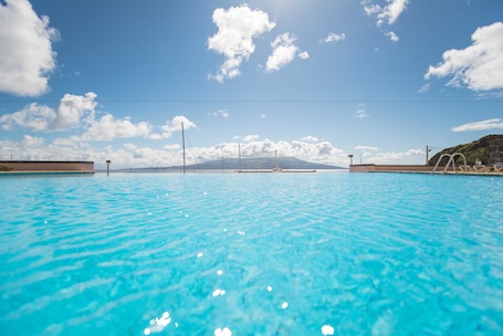 Indoor pool, outdoor pool, pool umbrellas, sun loungers