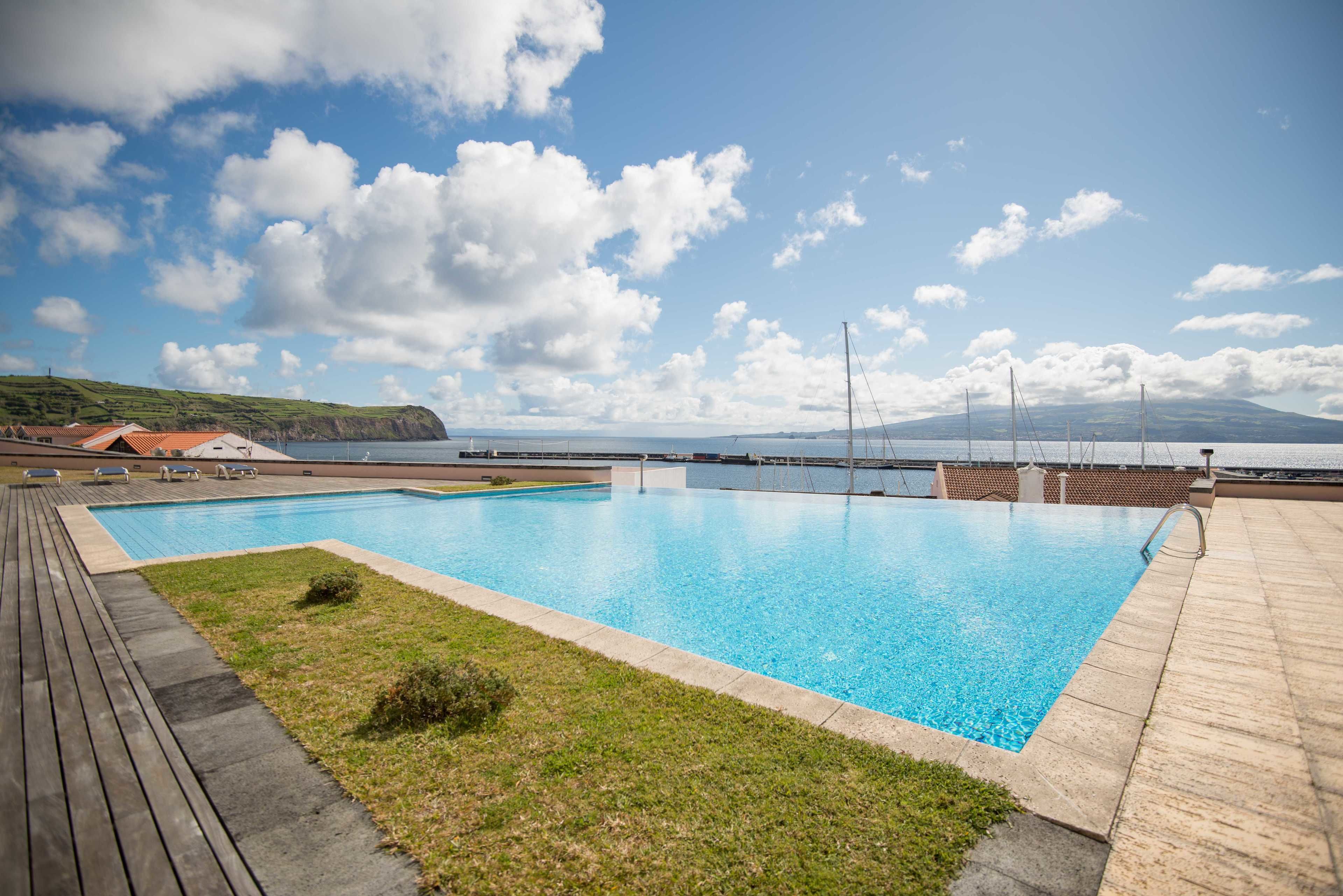 indoor pool, outdoor pool, pool umbrellas, pool loungers