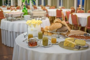 Enjoy a sumptuous spread of breads, pastries, and cheese at our dining area.