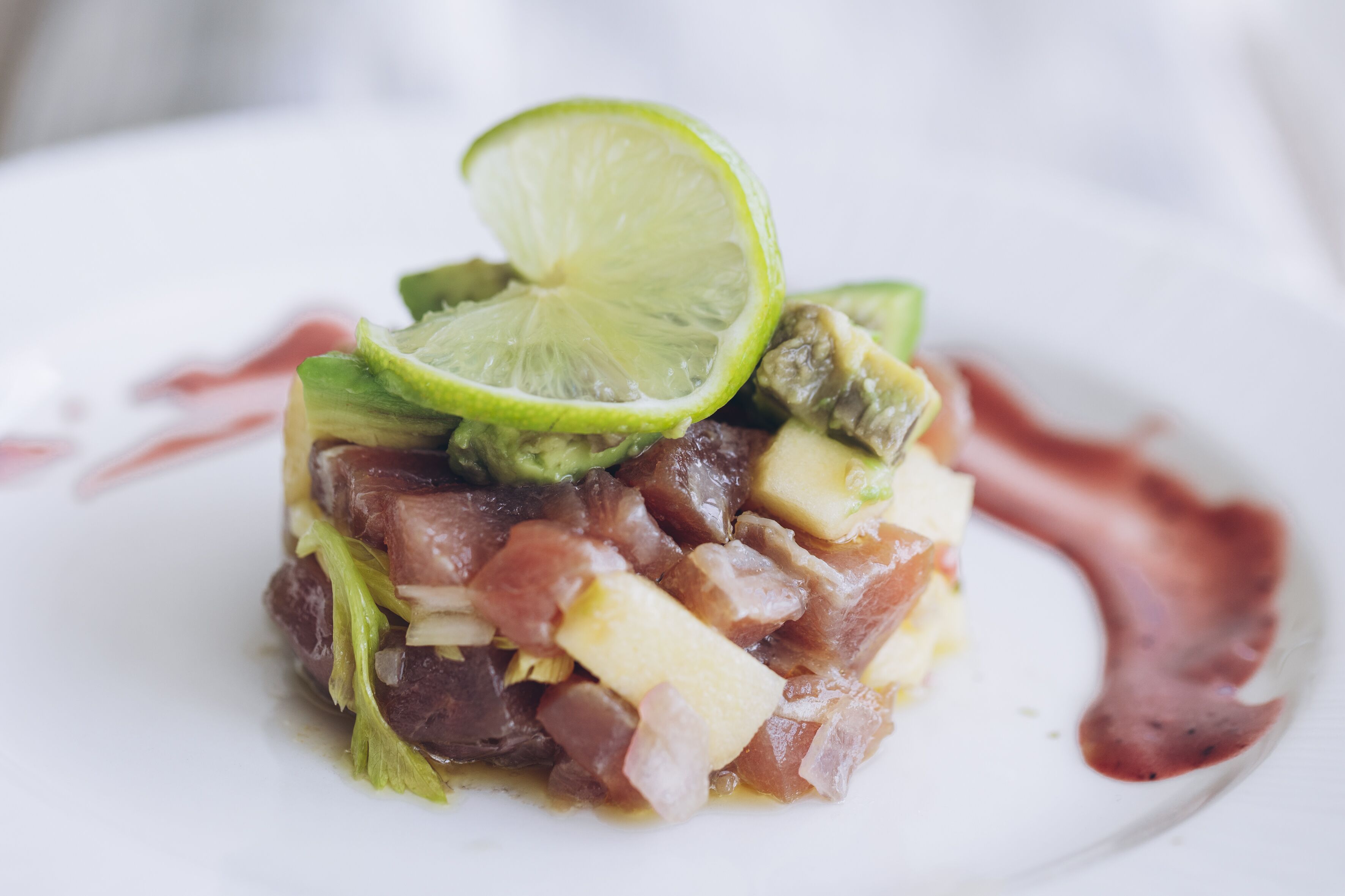 A dish with various ingredients on a white plate.