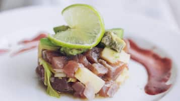 A dish with various ingredients on a white plate.
