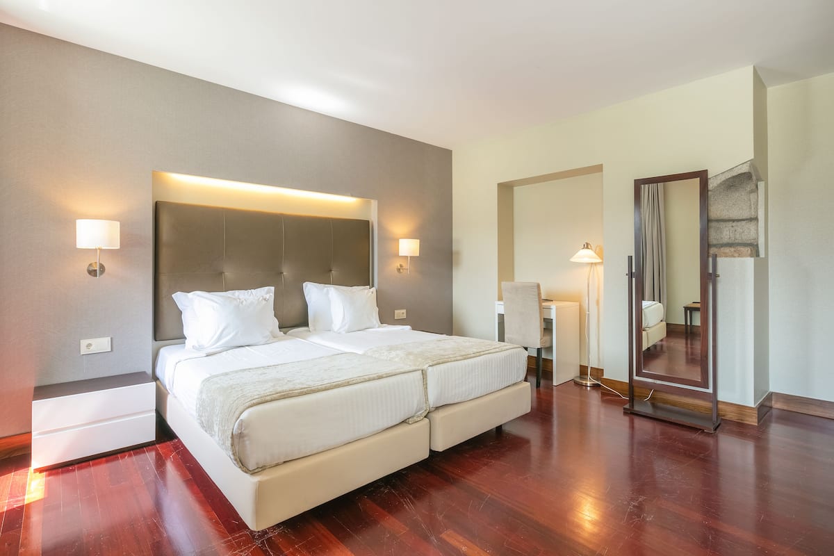 premium twin room | 1 bedroom, down duvets, in-room safe, desk