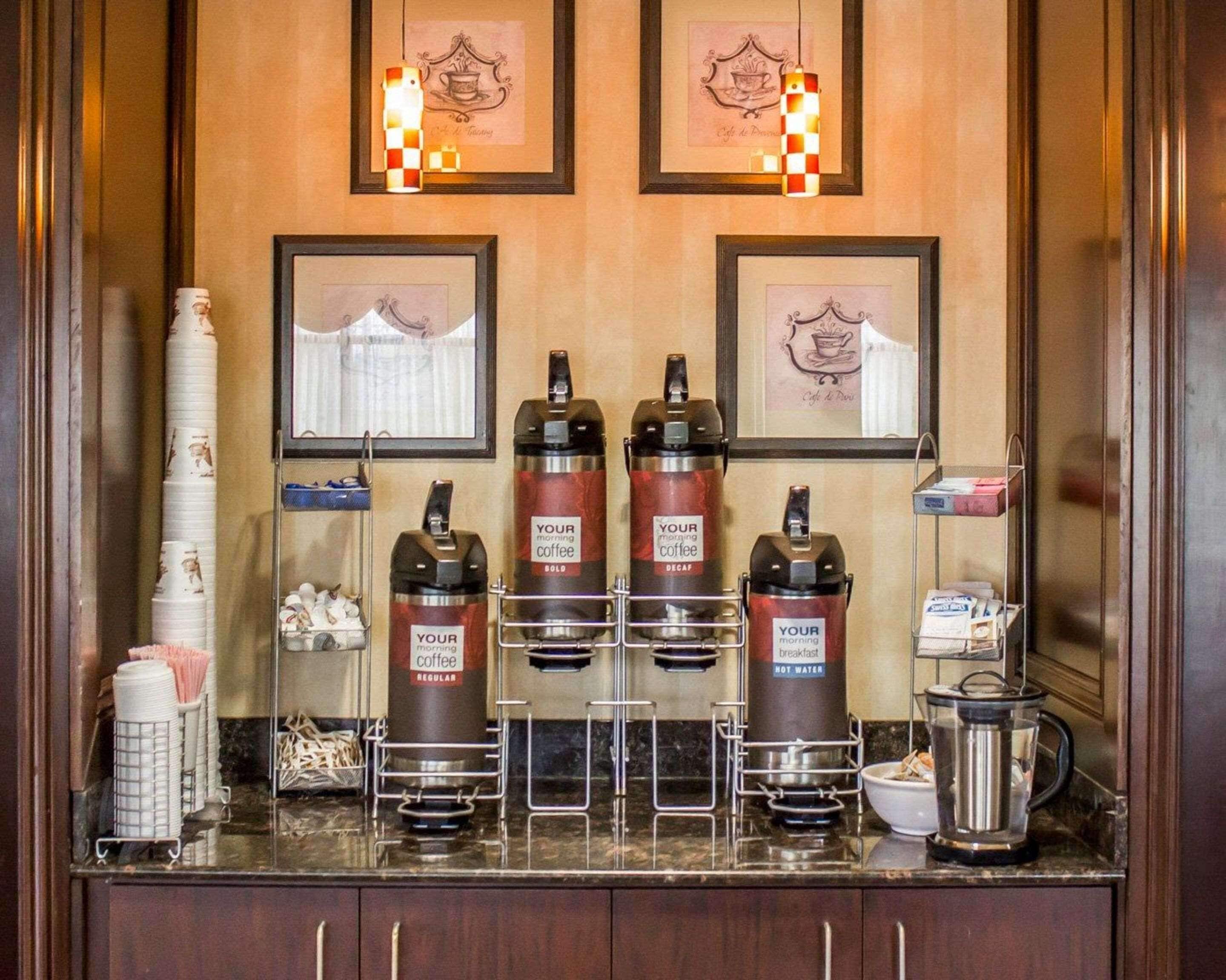 A coffee station with four dispensers labeled 'YOUR morning coffee' and 'YOUR morning breakfast hot water'.