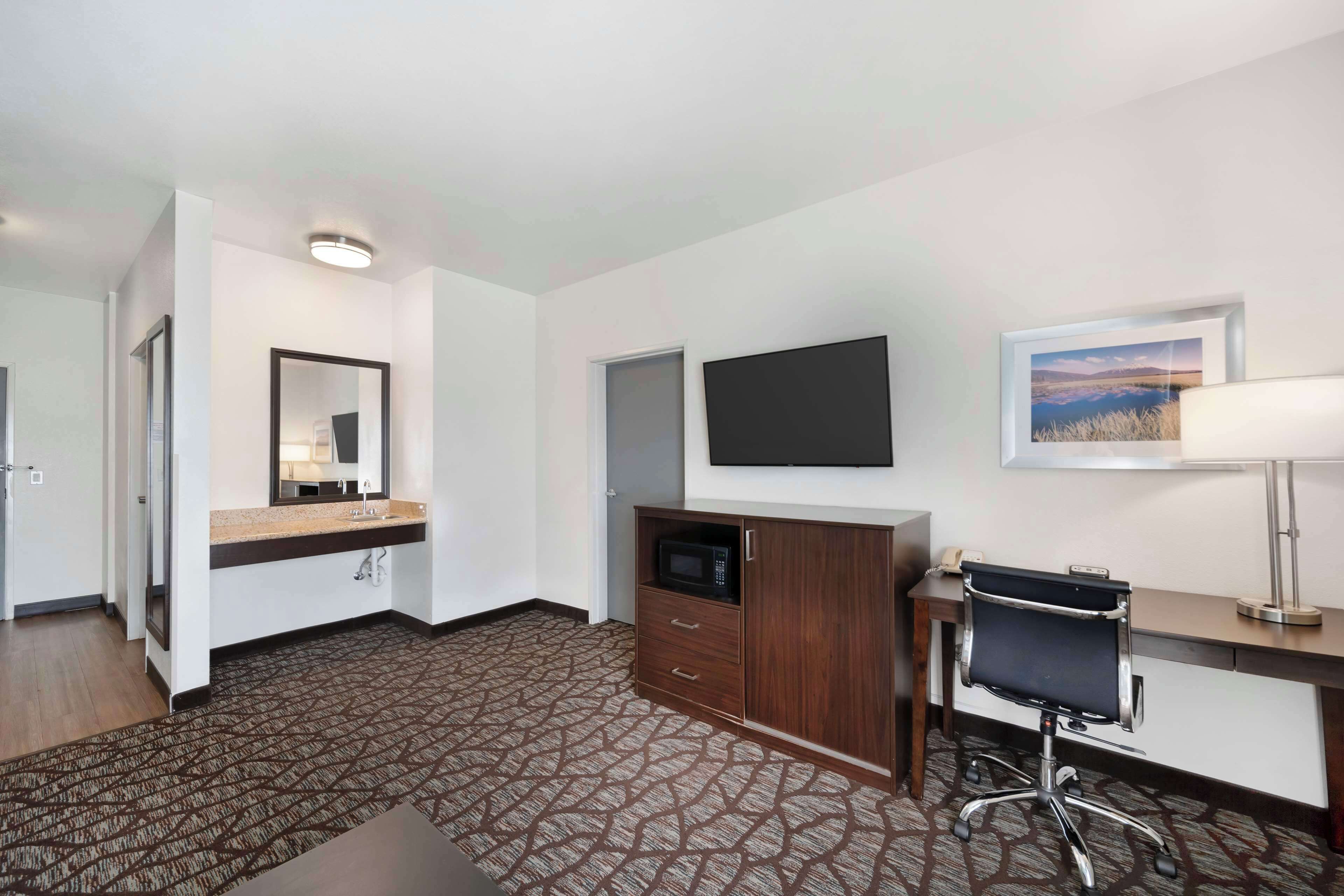 premium bedding, desk, laptop workspace, blackout curtains