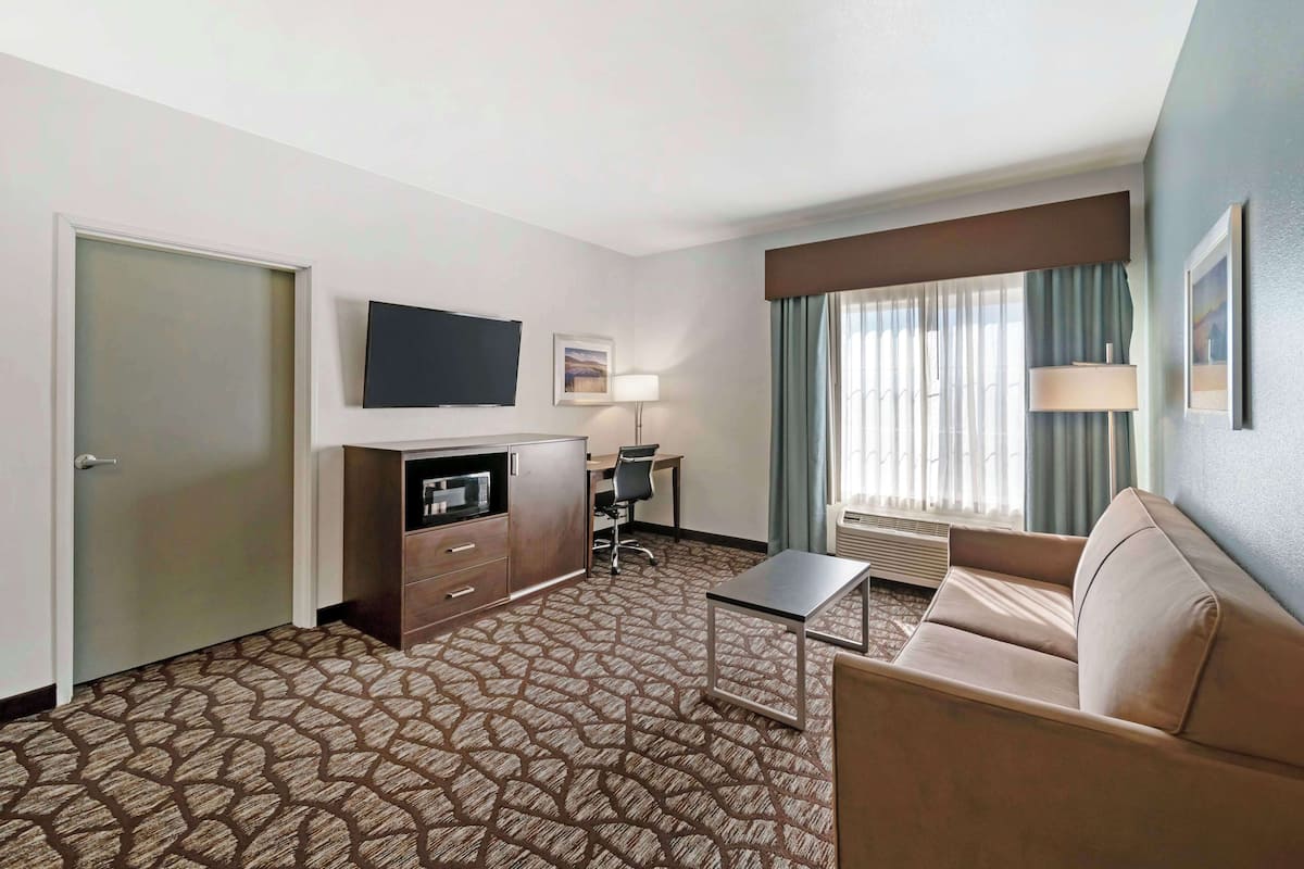 premium bedding, desk, laptop workspace, blackout curtains