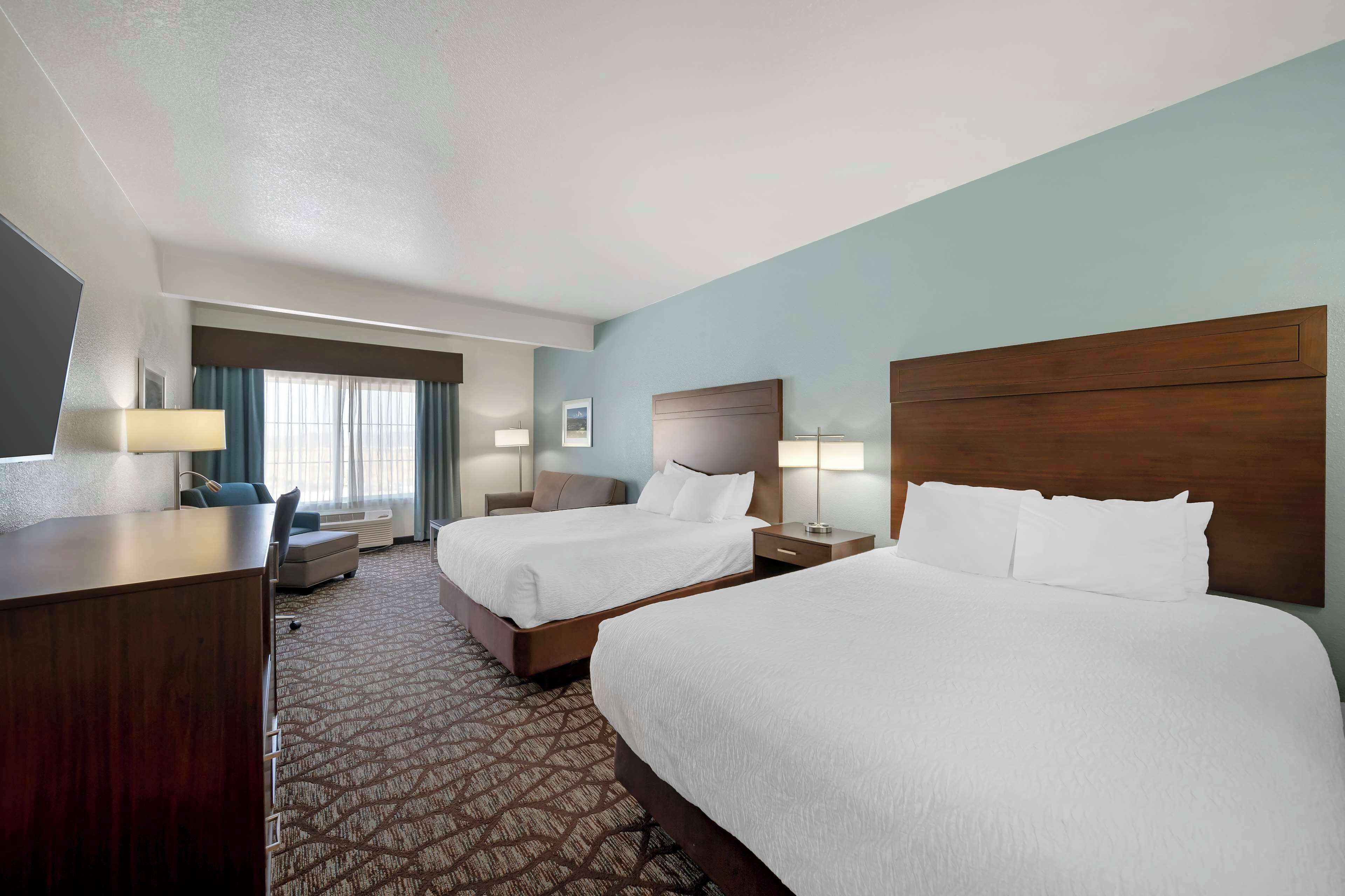 premium bedding, desk, laptop workspace, blackout curtains