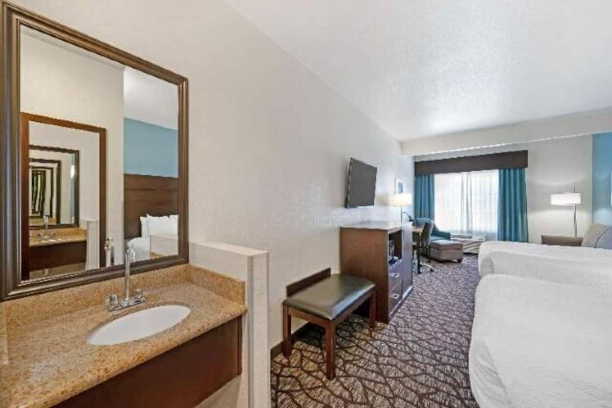 Premium bedding, desk, laptop workspace, blackout curtains
