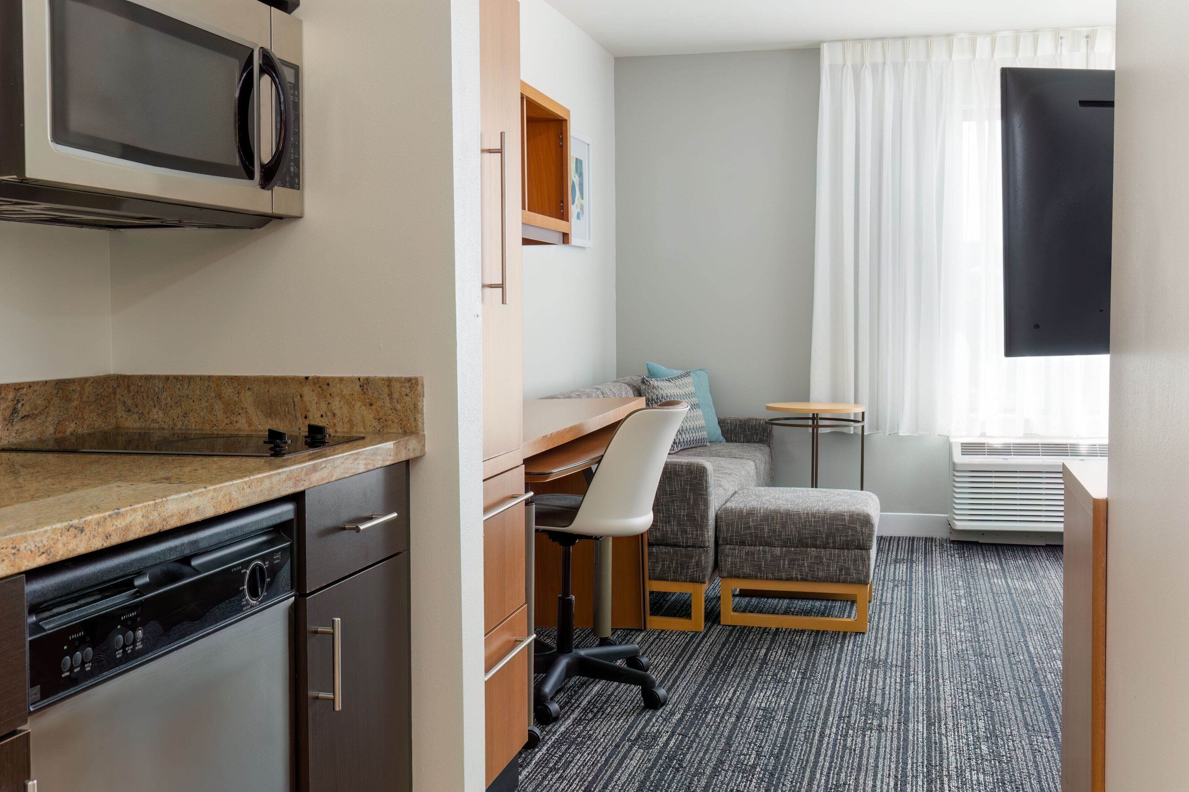 Full-size fridge, microwave, stovetop, dishwasher