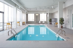 Indoor pool, open 8:00 AM to 10:00 PM, pool loungers