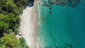 On the beach, beach umbrellas, beach towels, beach massages