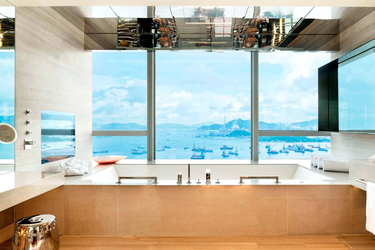 separate bathtub and shower, designer toiletries, hair dryer, bathrobes