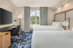 A hotel room with a desk, two beds, a TV, and a window with curtains. - Fairfield Inn & Suites by Marriott Hooksett (Hooksett)