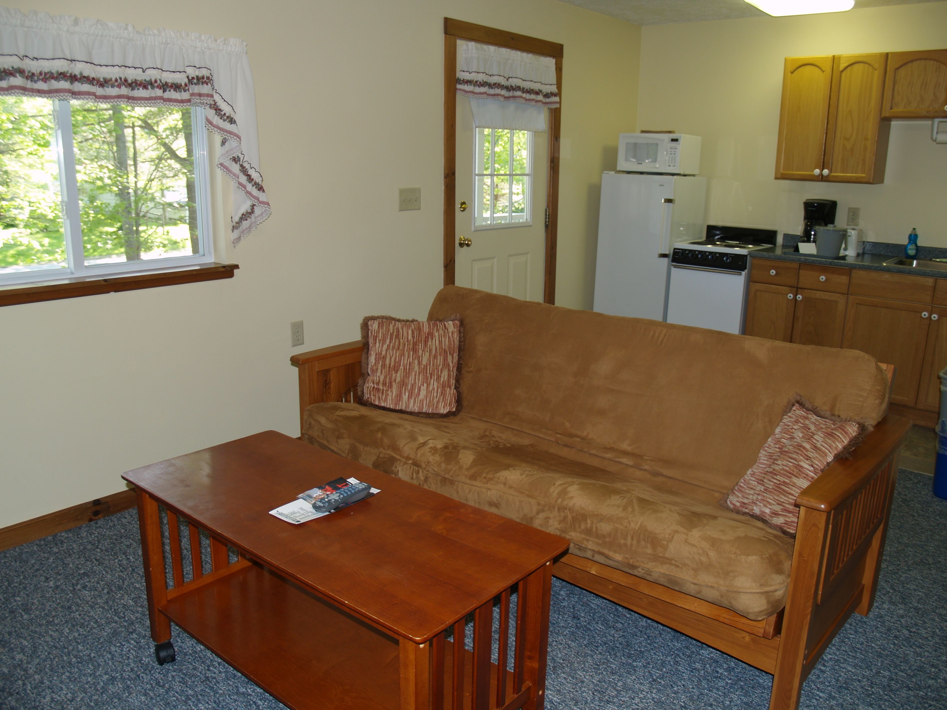 Deluxe Suite, 2 Bedrooms, Garden View | Living area | 34-inch flat-screen TV with digital channels, TV, books