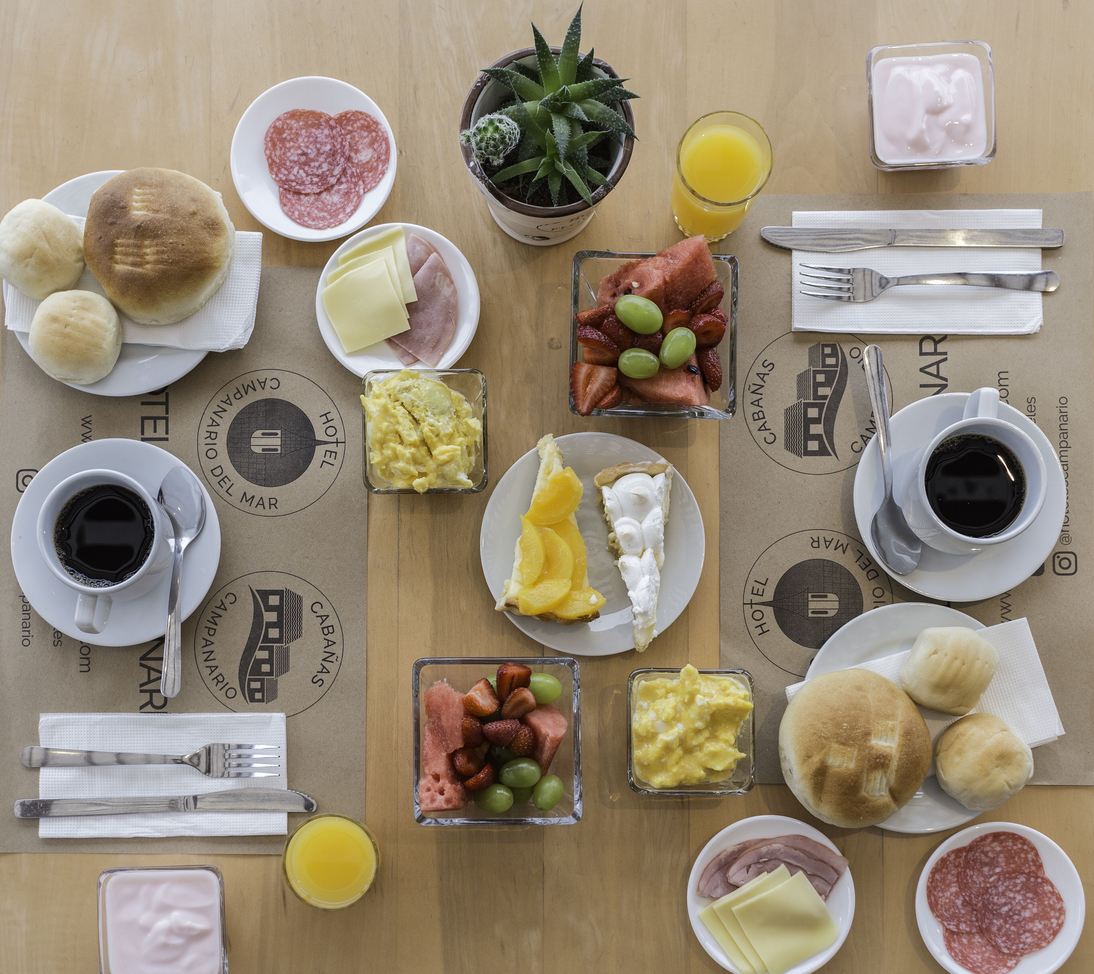 A breakfast buffet with various food items and beverages.