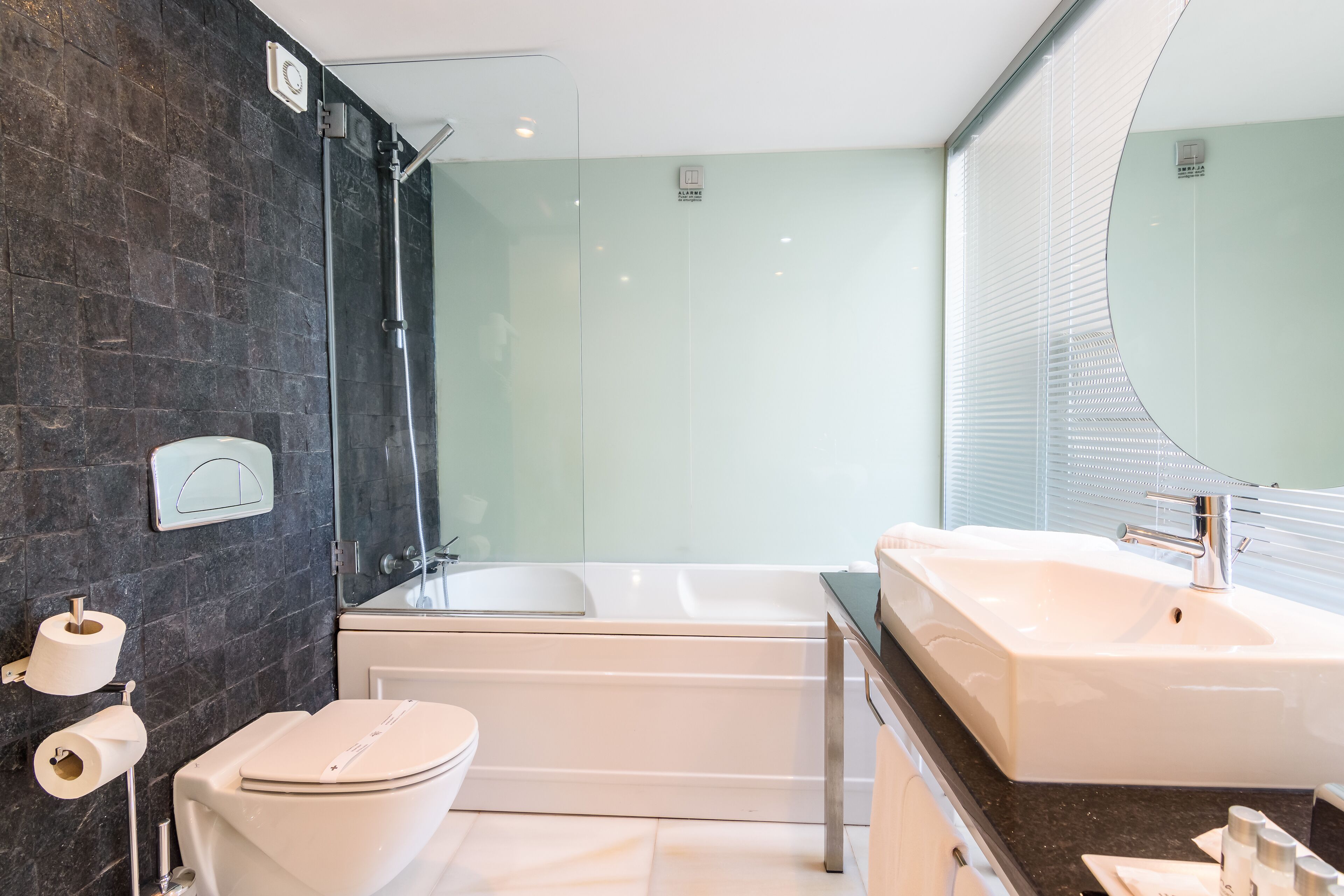 bathtub, hair dryer, towels