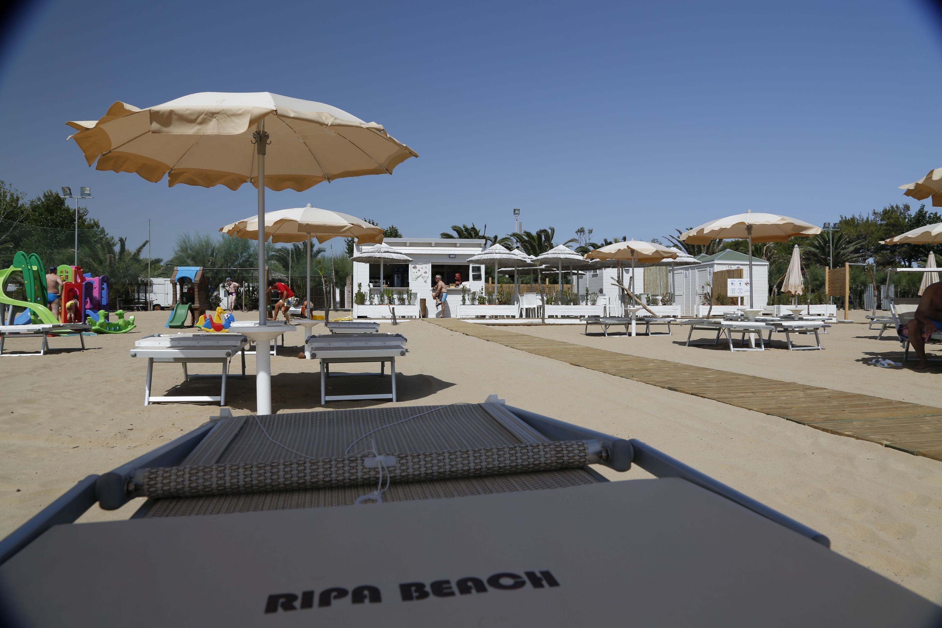 private beach, sun-loungers, beach umbrellas, beach bar