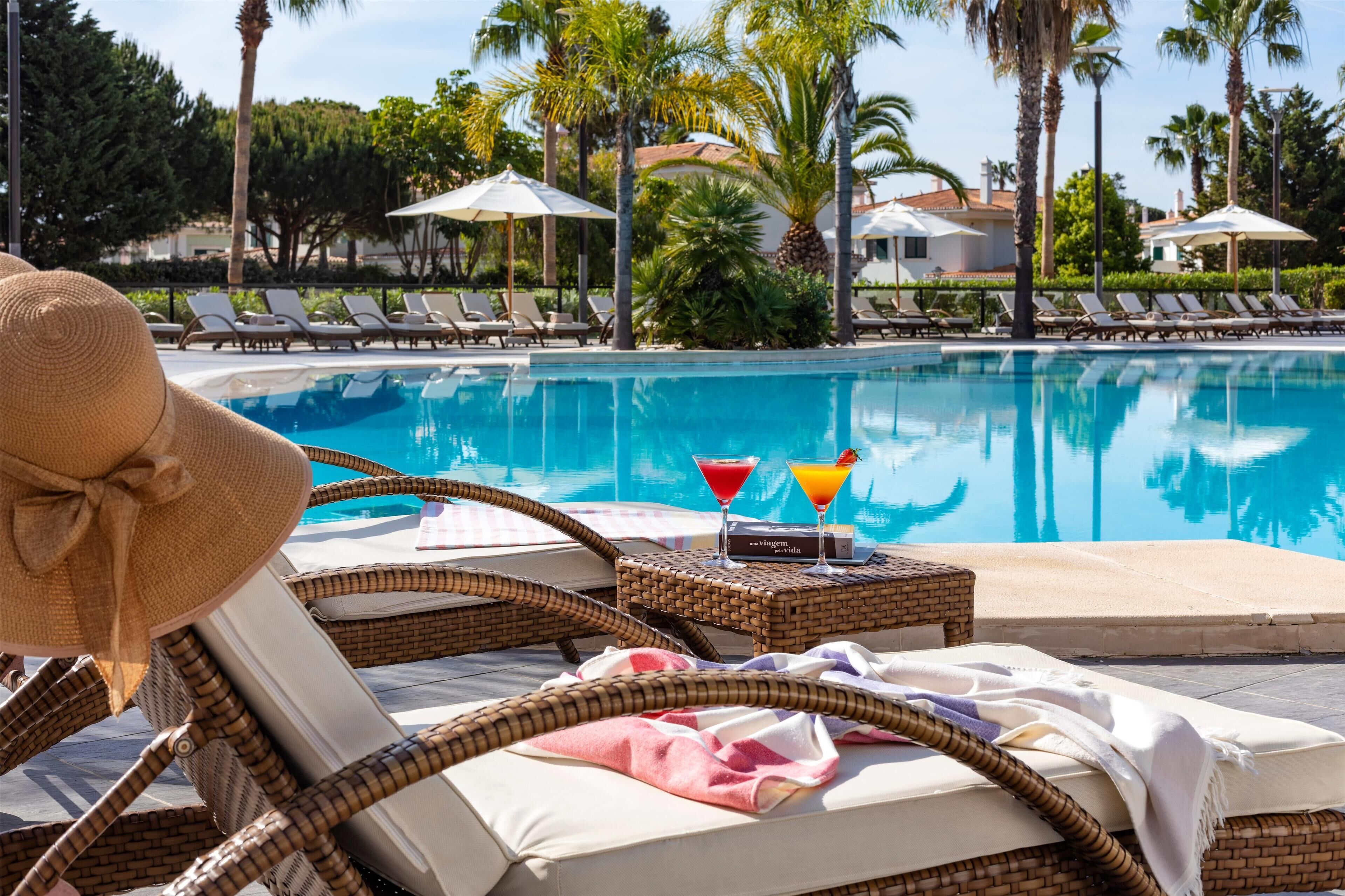 Indoor pool, 2 outdoor pools, open 9:00 AM to 7:00 PM, pool umbrellas