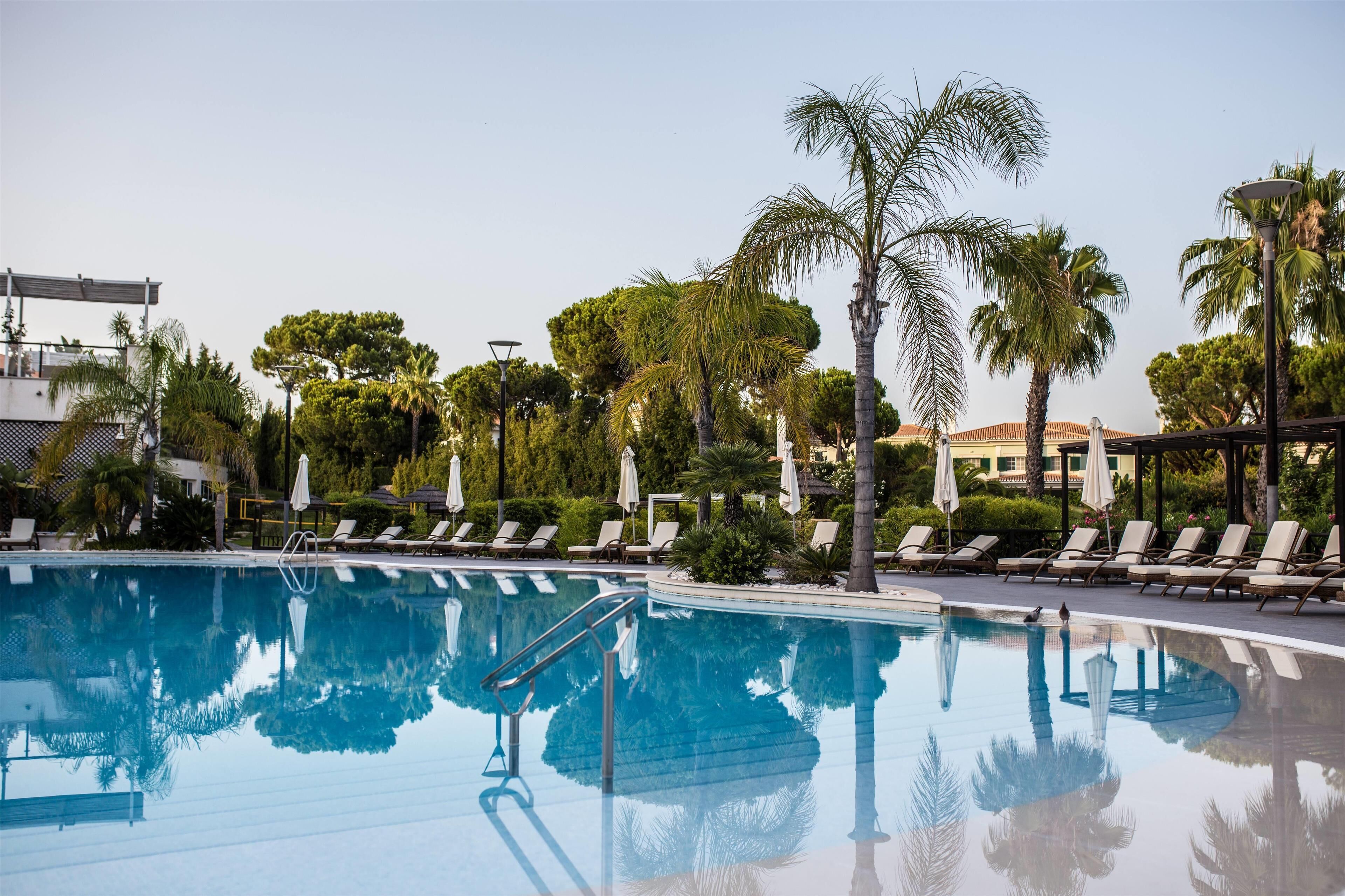 2 outdoor pools, open 7:00 am to 7:00 pm, pool umbrellas, pool loungers